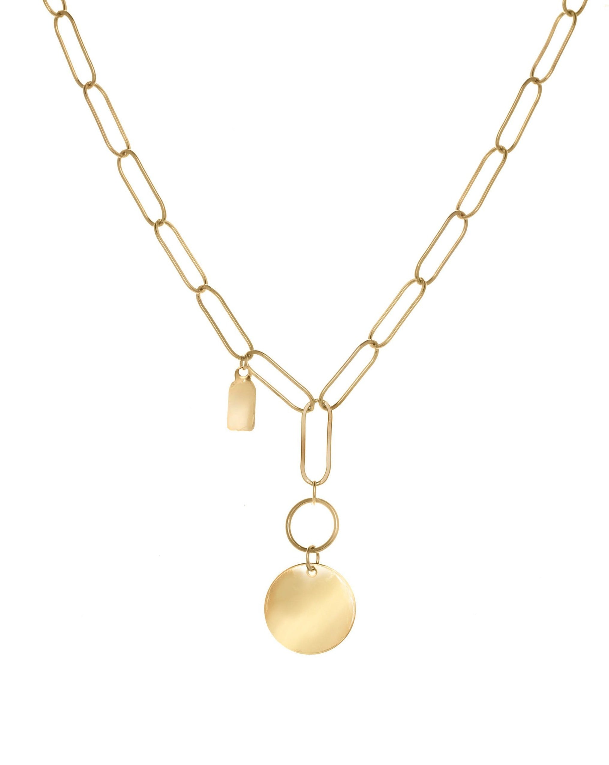 Scarlett Necklace by KOZAKH. A 16 to 18 inch adjustable length, flat oval chain necklace, crafted in 14K Gold Filled, featuring a 3x5mm Tag and a 16mm Flat coin.