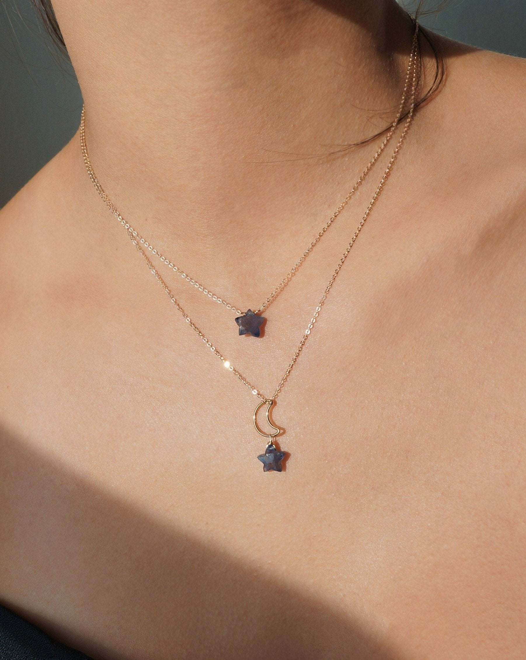Star Necklace by KOZAKH. A 16 to 18 inch adjustable length necklace, crafted in 14K Gold Filled, featuring an Iolite star charm.