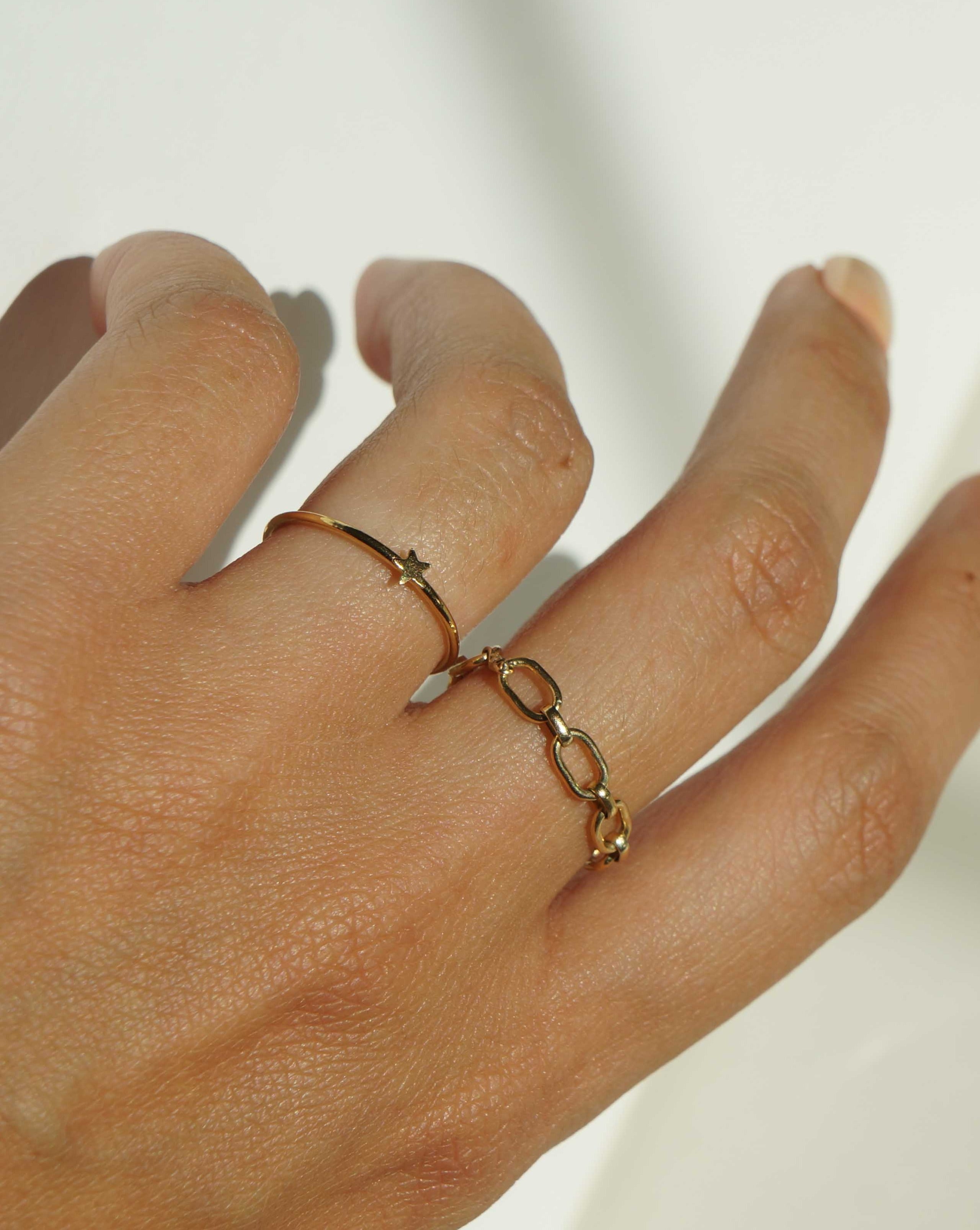 Star Ring by KOZAKH. A 1mm band, crafted in 14K Gold Filled, featuring a star shape design.