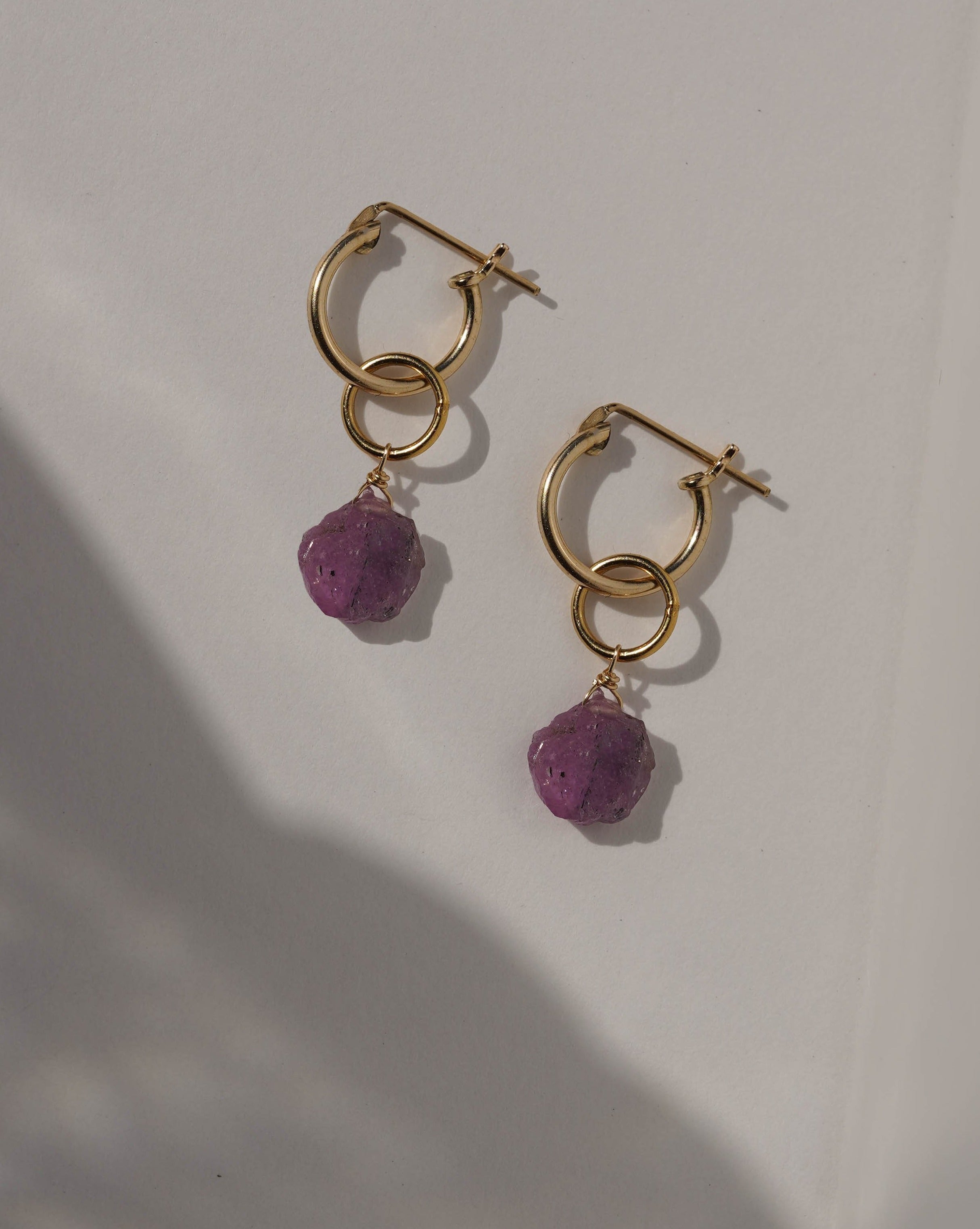 Sugar Earrings by KOZAKH. 12mm snap closure hoop earrings, with 1 inch drop length, crafted in 14K Gold Filled, featuring a Pink Tourmaline slice.