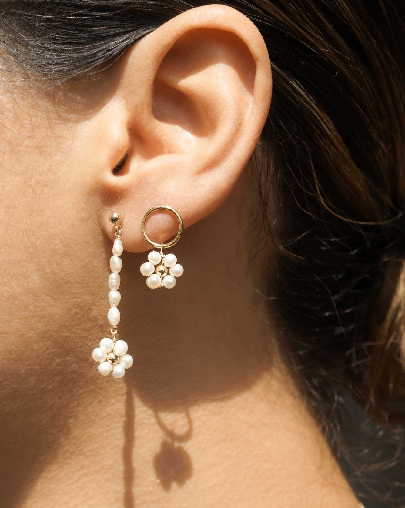 Sunflower Earrings by KOZAKH. 3mm Ball stud drop earrings with 2 inches drop length, crafted in 14K Gold Filled, featuring 3mm rice freshwater Pearls and 3-4mm round freshwater Pearls forming a flower charm.