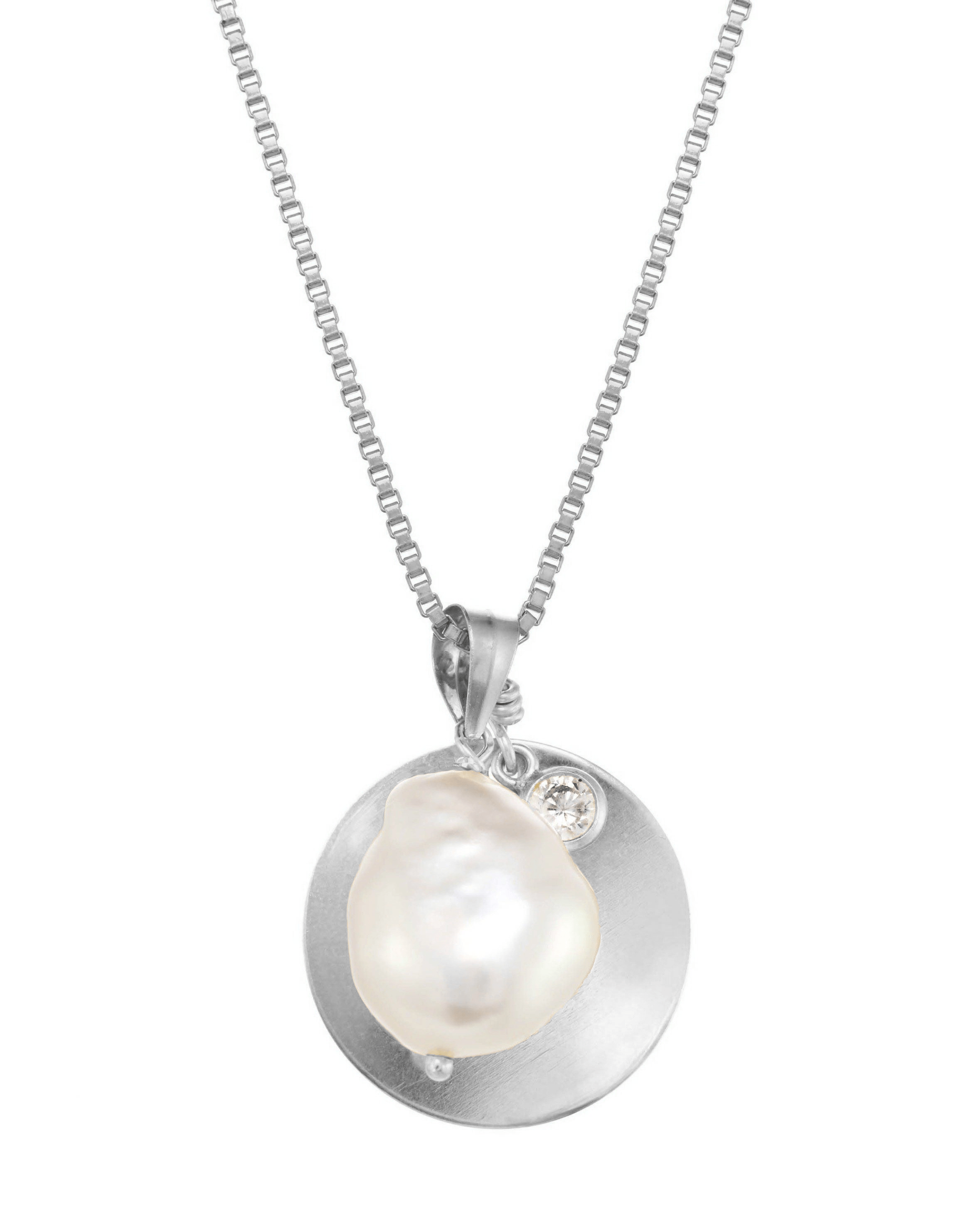 Sylet Necklace by KOZAKH. A 16 to 18 inch adjustable length necklace, crafted in Sterling Silver, featuring a 9mm Oval pearl, a 16mm Coin medallion, and a 3mm Cubic Zirconia bezel.