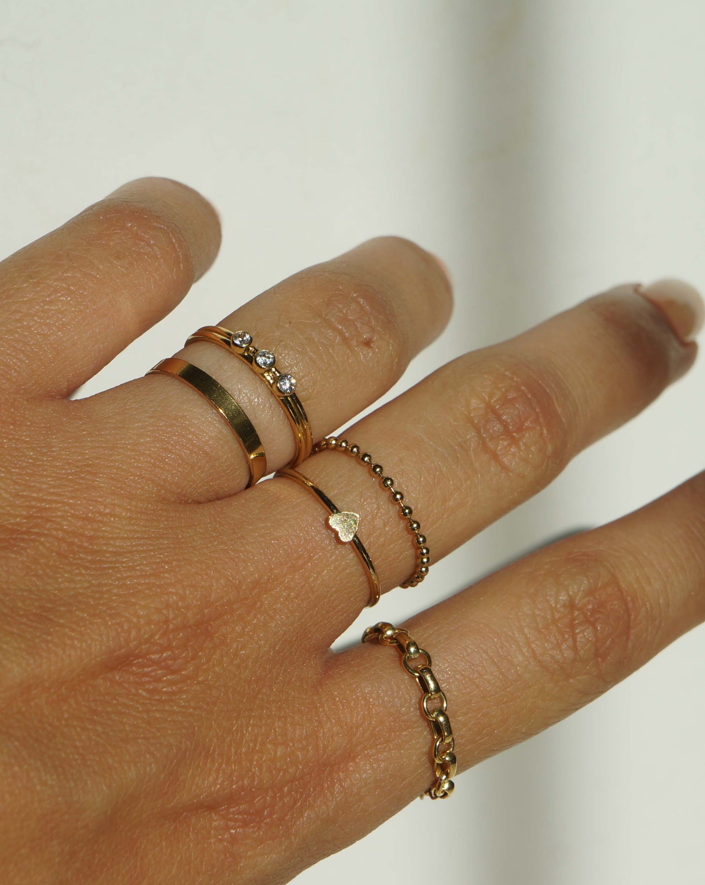 Tres Dia Ring by KOZAKH. A 1mm double band, crafted in 14K Gold Filled, featuring three 2mm Cubic Zirconias.