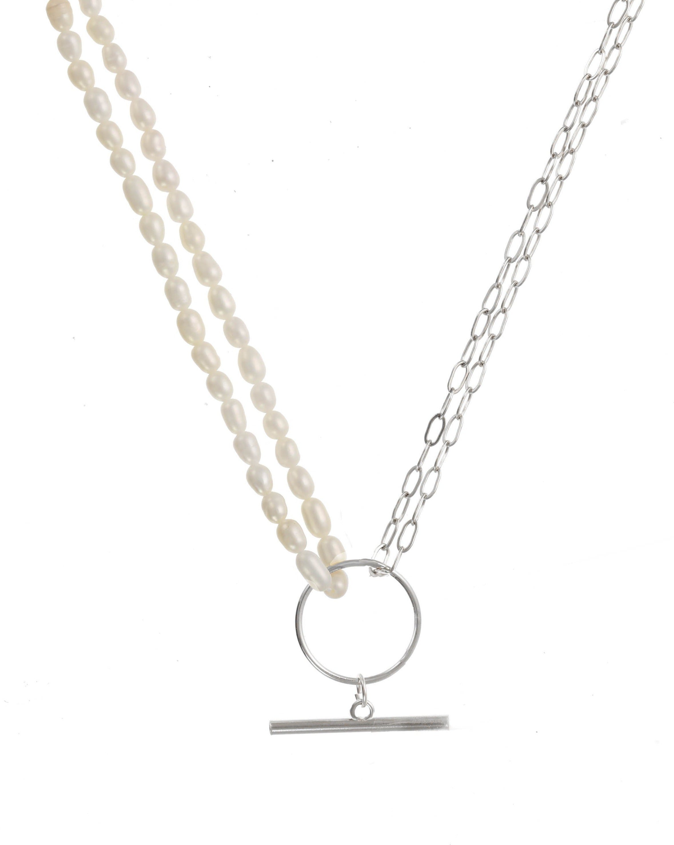 Trillian Necklace by KOZAKH. A 16 to 18 inch adjustable length necklace, with 4mm white pearl strand on one half, the other half is crafted in Sterling Silver, featuring a horizontal bar.