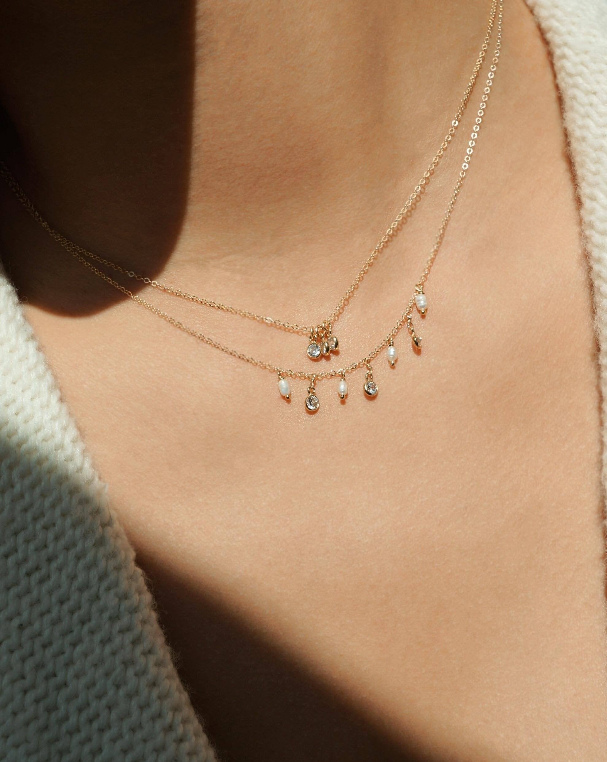 Trizare Necklace by KOZAKH. A 16 to 18 inch adjustable length necklace, crafted in 14K Gold Filled, featuring 3mm Cubic Zirconia bezels.