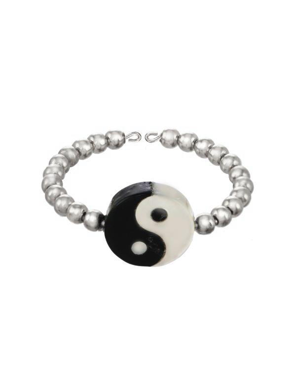 Yin Yang Ring by KOZAKH. A 2mm gold beaded band, crafted in Sterling Silver, featuring a hand carved Mother of pearl Yin Yang charm.