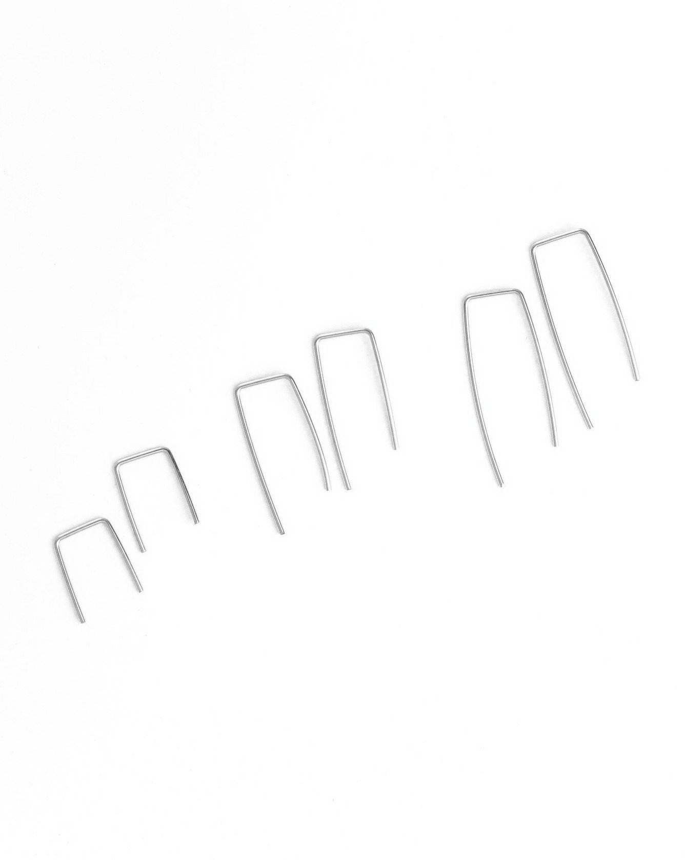 You Earrings by KOZAKH. Hand shaped minimalist bar earrings, crafted in Sterling Silver.