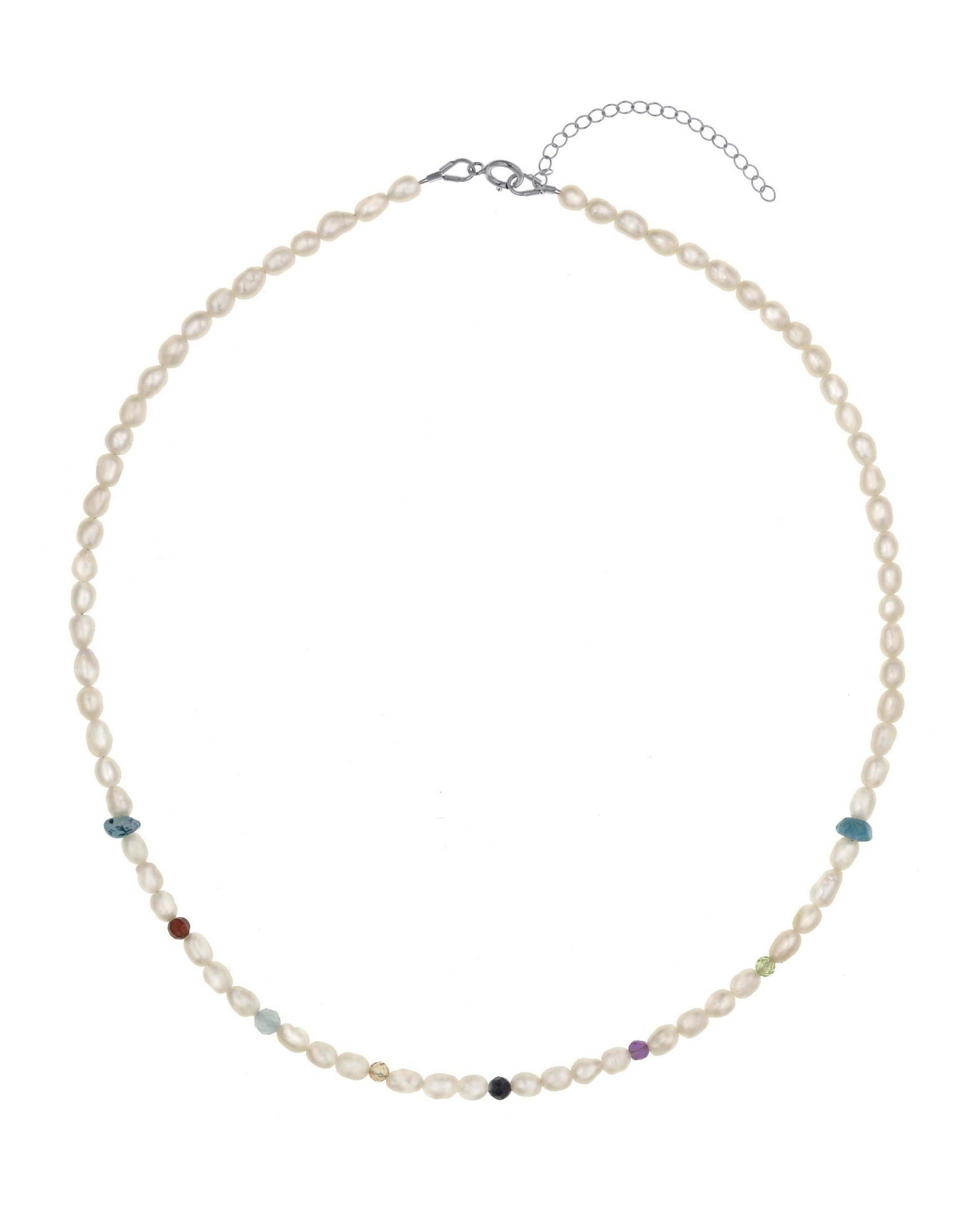 Zulema Necklace by KOZAKH. A 16 to 18 inch adjustable length, freshwater rice pearl strand necklace, clasp crafted in Sterling Silver, featuring Turquoise, Peridot, Sapphire, Topaz, Garnet, Aquamarine, and Amethyst gemstones.